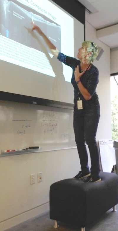 Dr. Runge using a stool to teach an anodizing class.