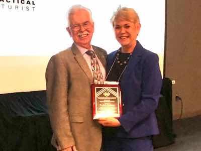 Dr. Runge received the NASF Scientific Award from Tony Revier from Uyemura.
