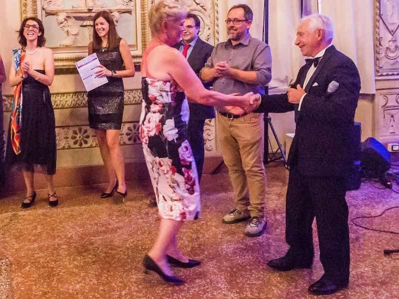 Dr. Runge receives an award from an international anodizing organization.