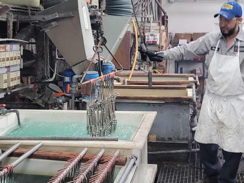 man finishing parts