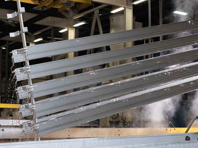 metal being dipped into tank