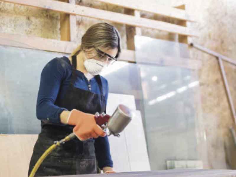 woman spraying paint