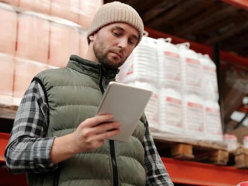 man looking at checklist