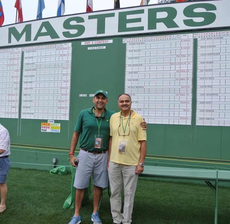 Pinakin Patel, right, and his son, Tej, take in the Master's Golf Tournament.