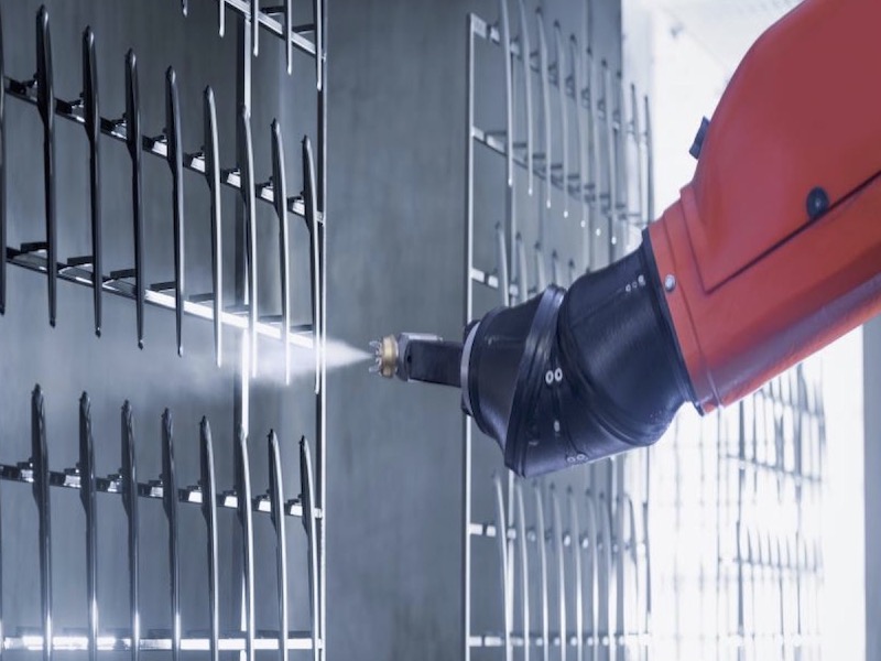 parts being sprayed by a robot