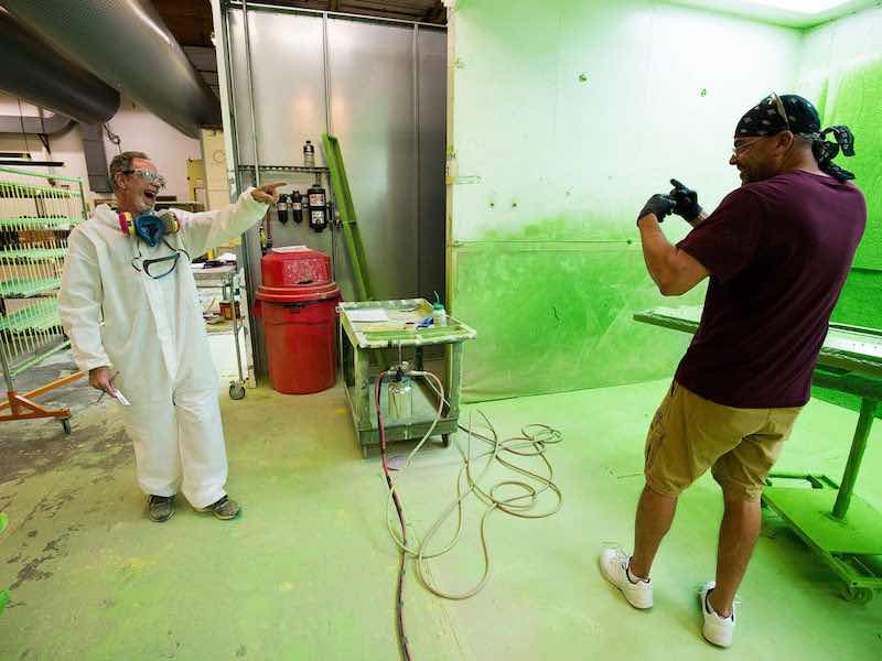 two men talking at paint shop