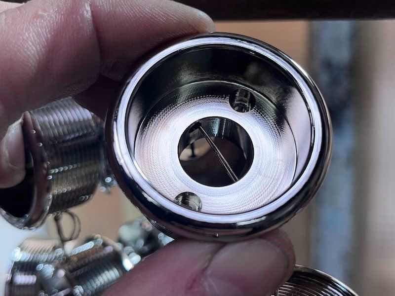 plated part held in someone's hand