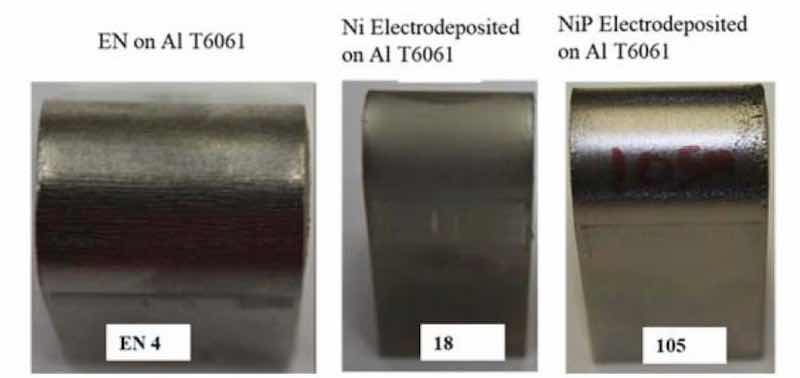 Figure 8 - Left to right: The inflection point of the electroless NiP (EN4), electrolytic Ni (18) and electrolytic NiP (105) coupons after the 0.25â bend radius test.